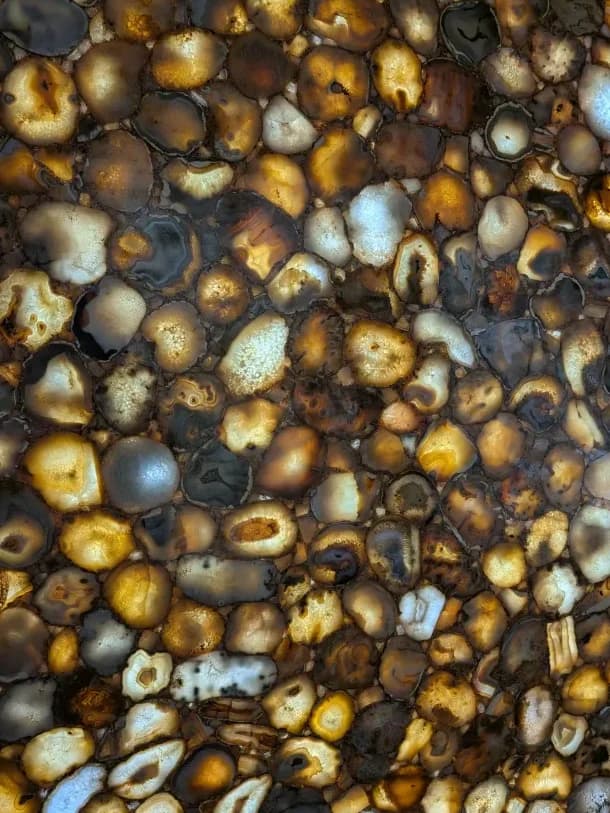 backlit amber and gold agate pebbles