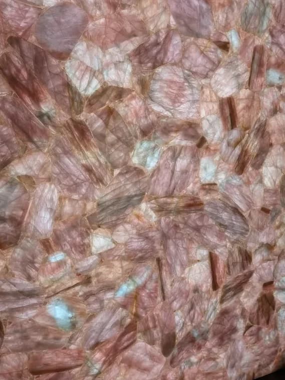 a backlit panel of rose-pink quartz shards