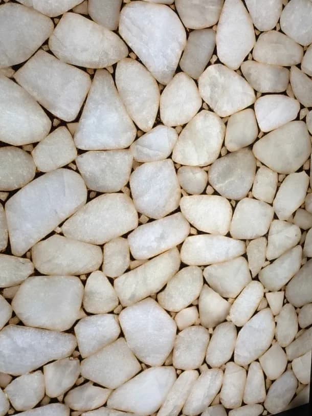 backlit white quartz cobbles set in a pale matrix