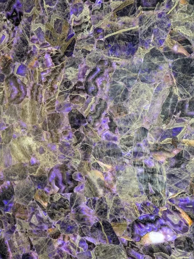 a backlit panel shot through with violet and gold