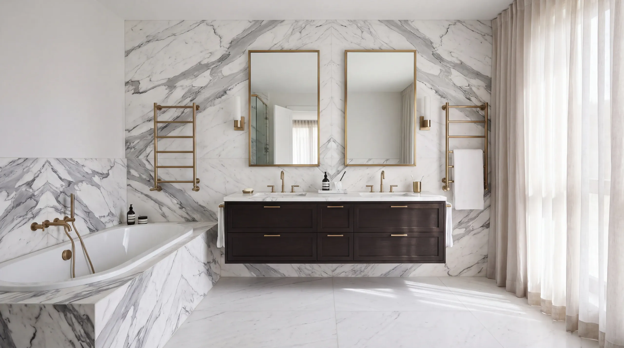 A bathroom with a floating vanity and a full wall in veined white marble
