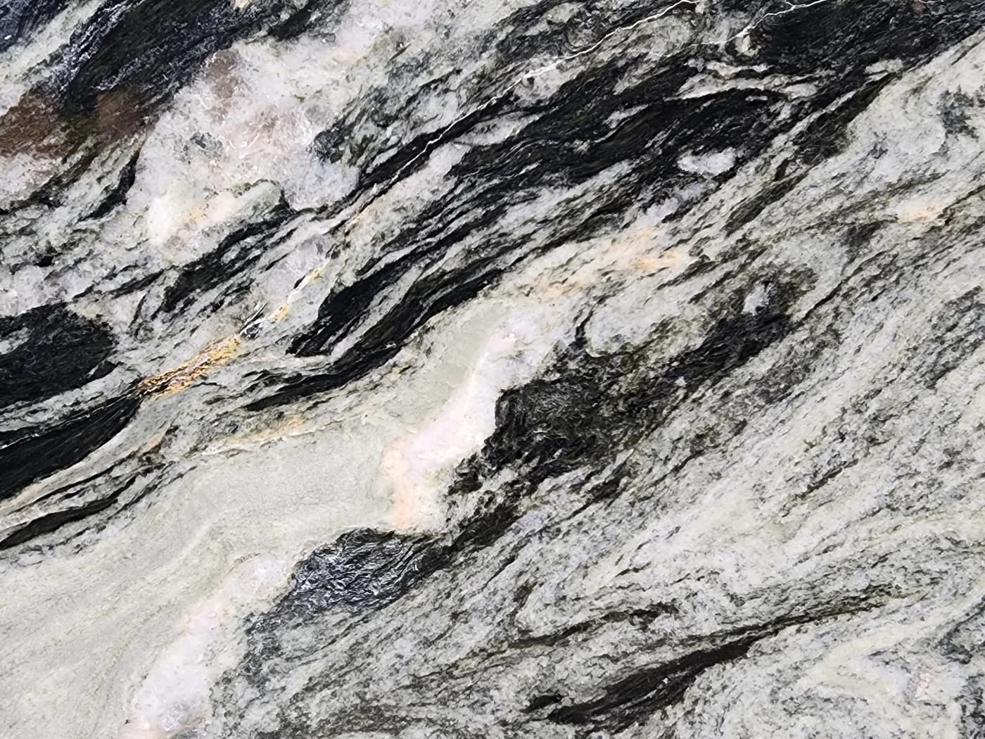 Illusion Blue dolomite, pale green and cream cut through with black