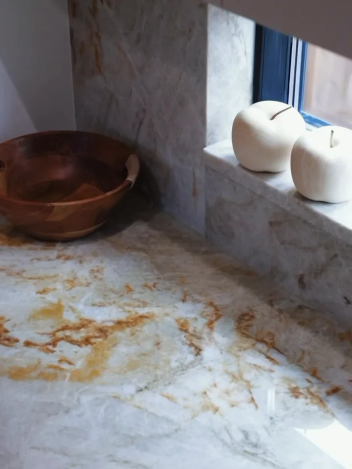 A gold-veined quartzite counter running into a matching stone splash