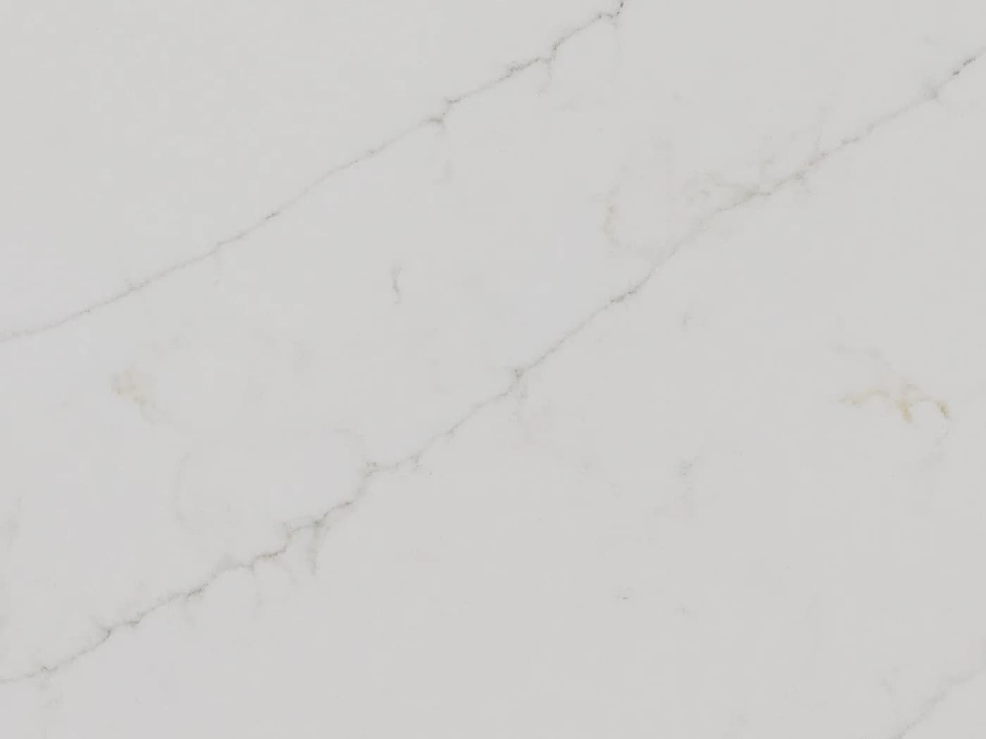 AQ Calacatta Colordo quartz, white with a grey diagonal vein and warm gold accents