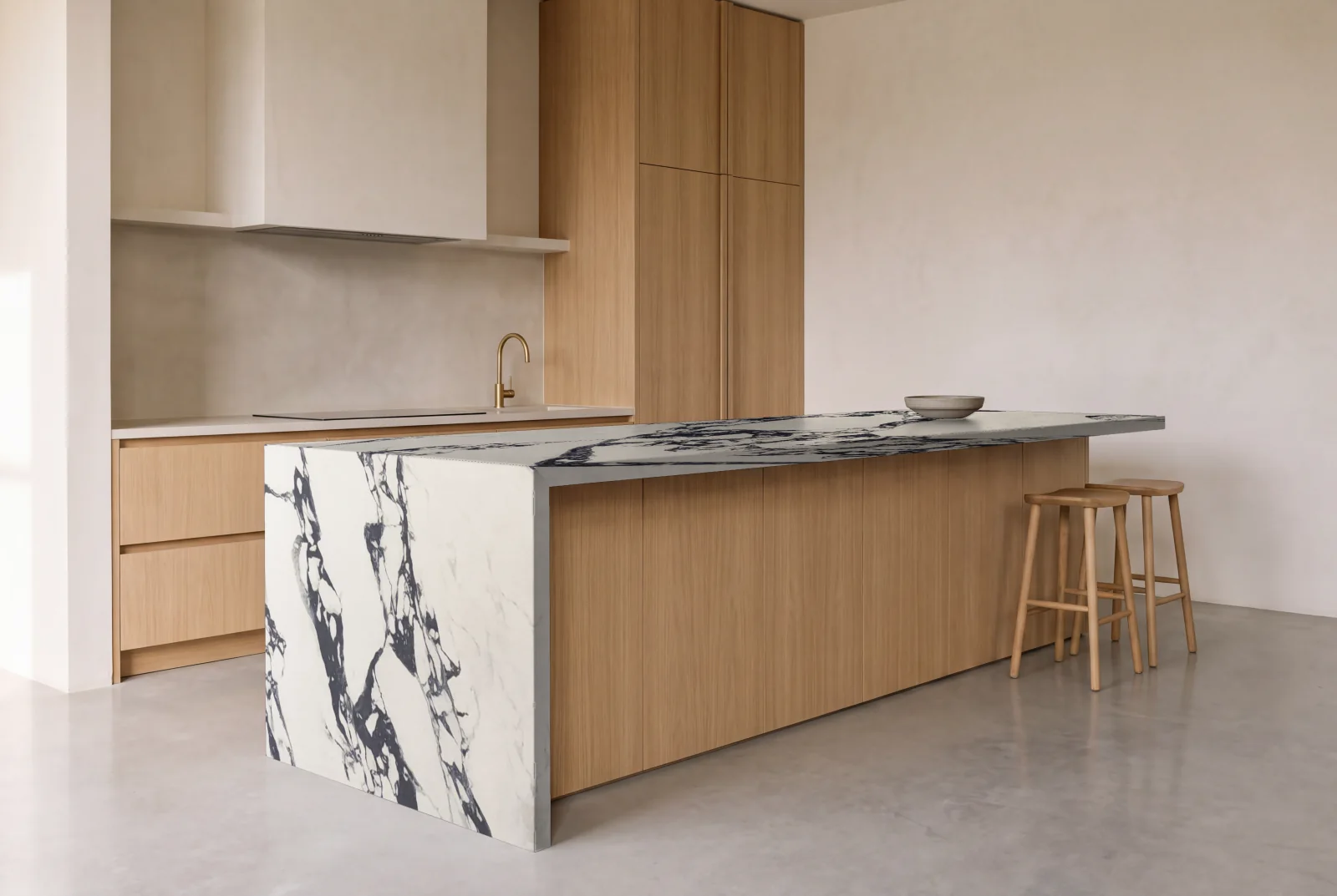 Visualization of Arabescato Corchia as a waterfall island in an oak kitchen