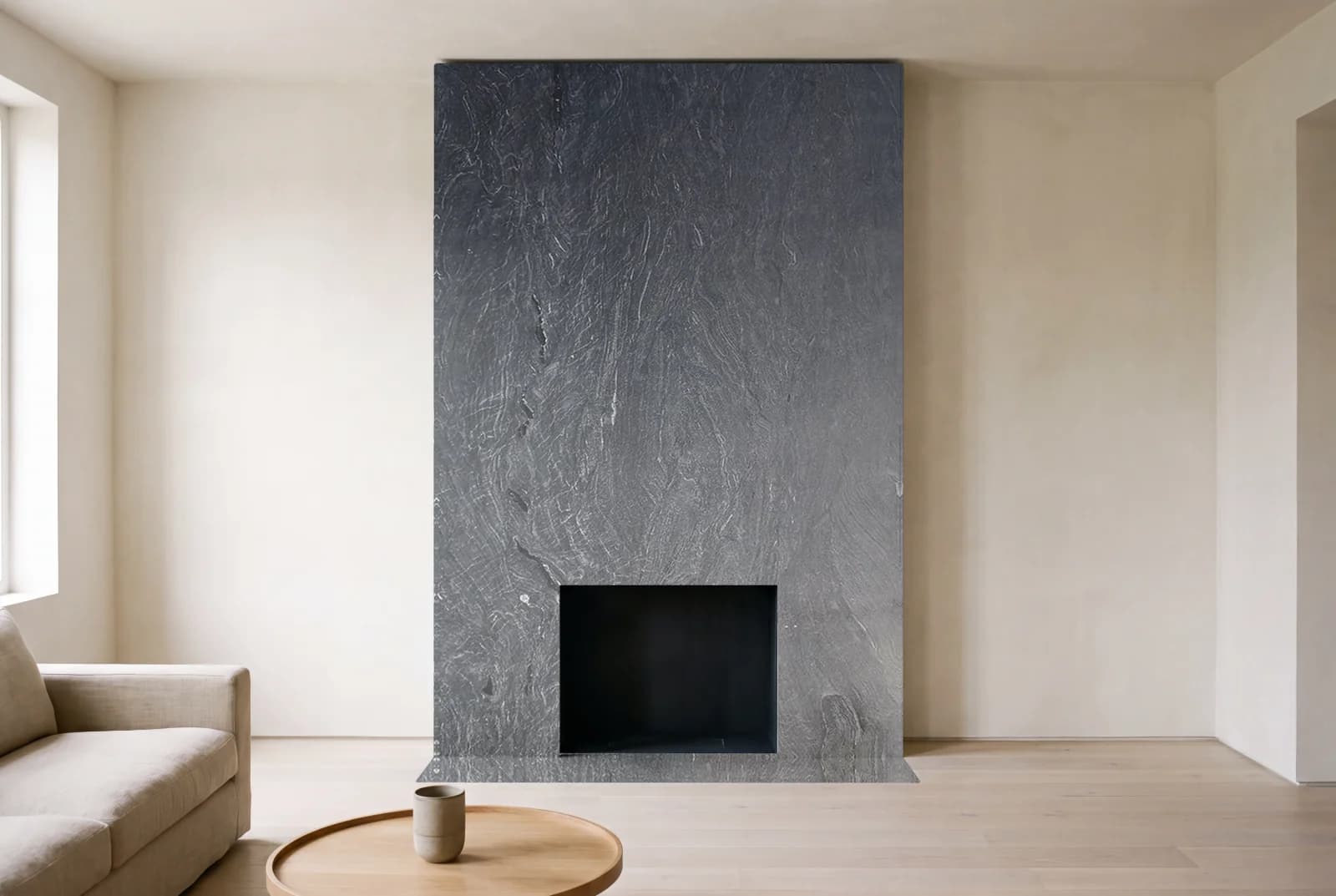 Visualization of Black Velvet Honed as a floor-to-ceiling fireplace wall in a living room