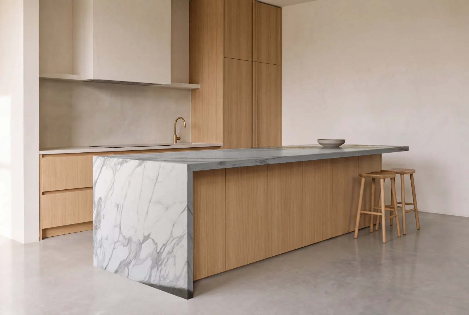 Visualization of Calacatta Borghini Honed as a waterfall island in an oak kitchen