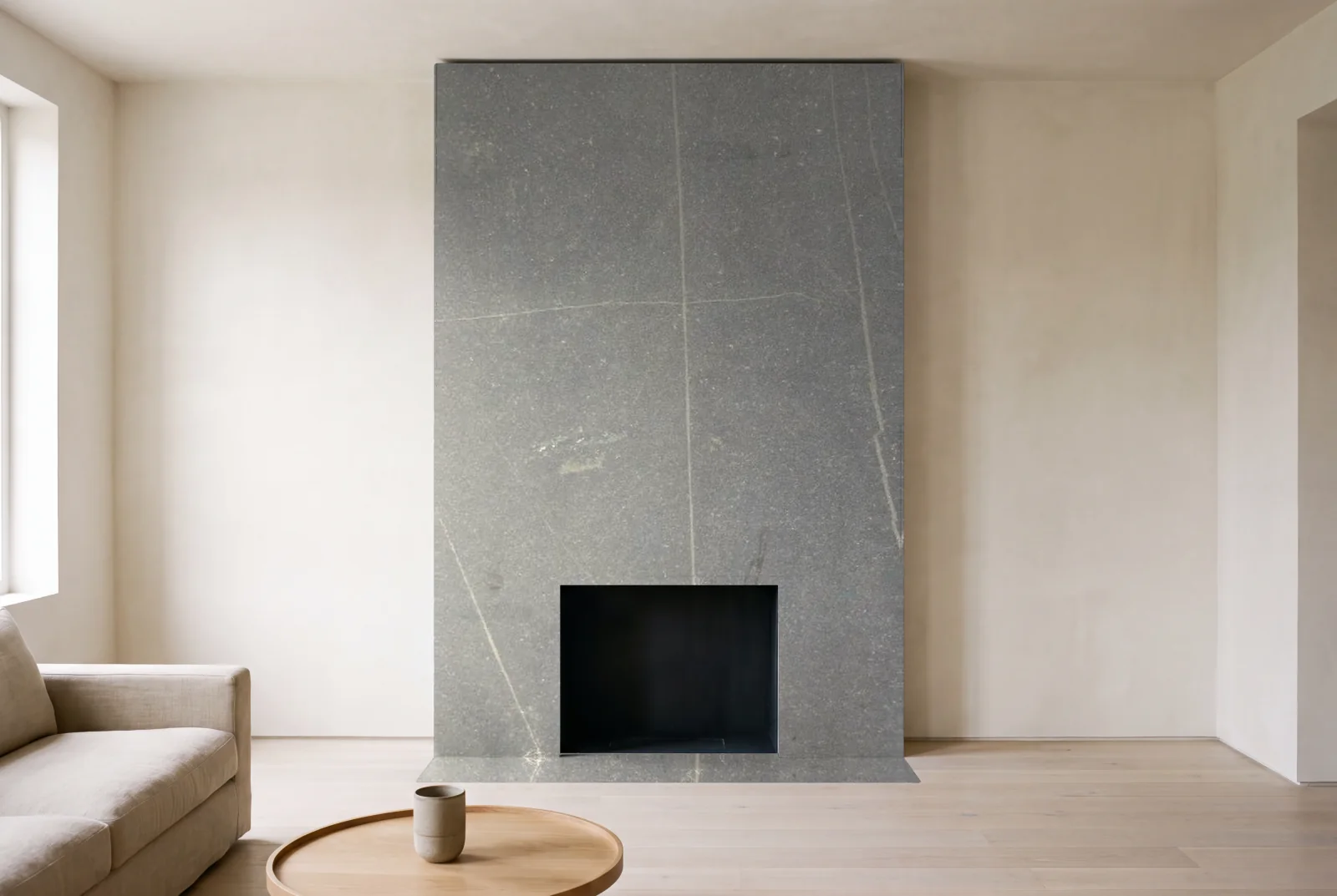Visualization of Preto Magnitos Honed as a floor-to-ceiling fireplace wall in a living room