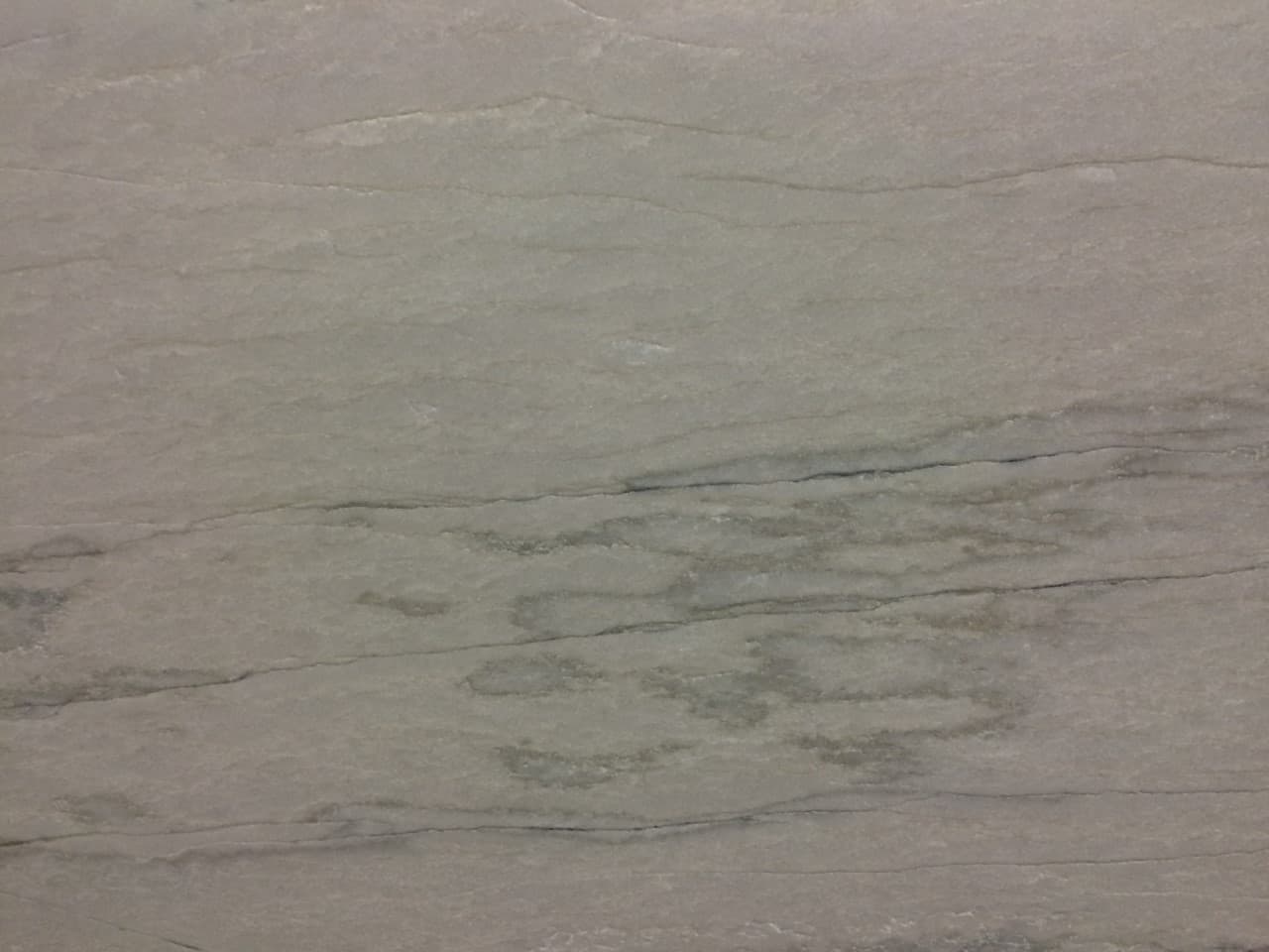 White Macaubas Leather, a quartzite slab, at KLZ Stone Supply in Dallas