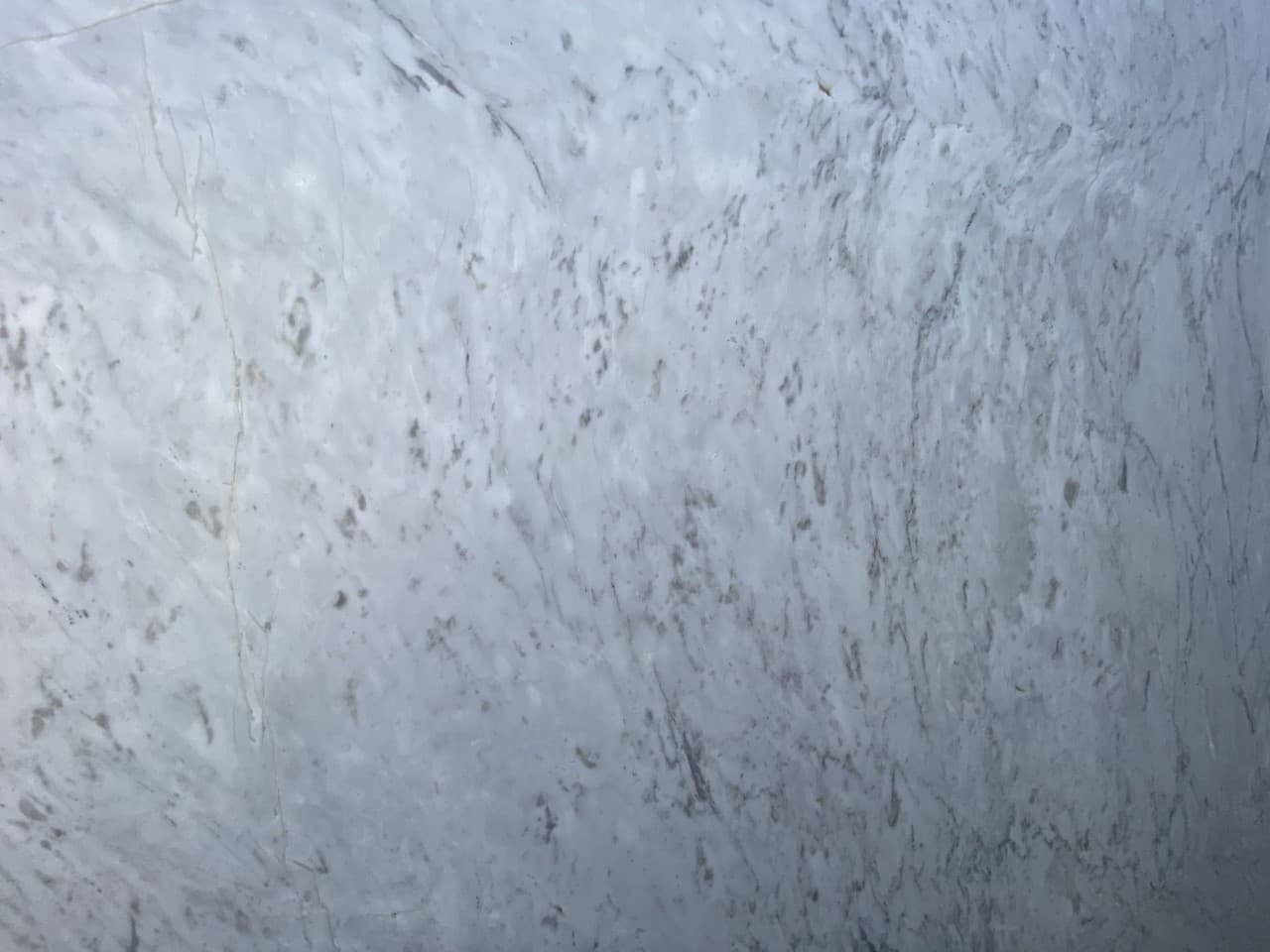 White Carrara Leathered, a marble slab, at KLZ Stone Supply in Dallas