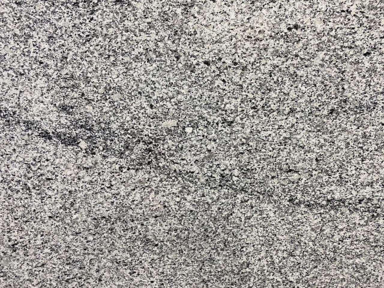Dalmata STD, a granite slab, at KLZ Stone Supply in Dallas