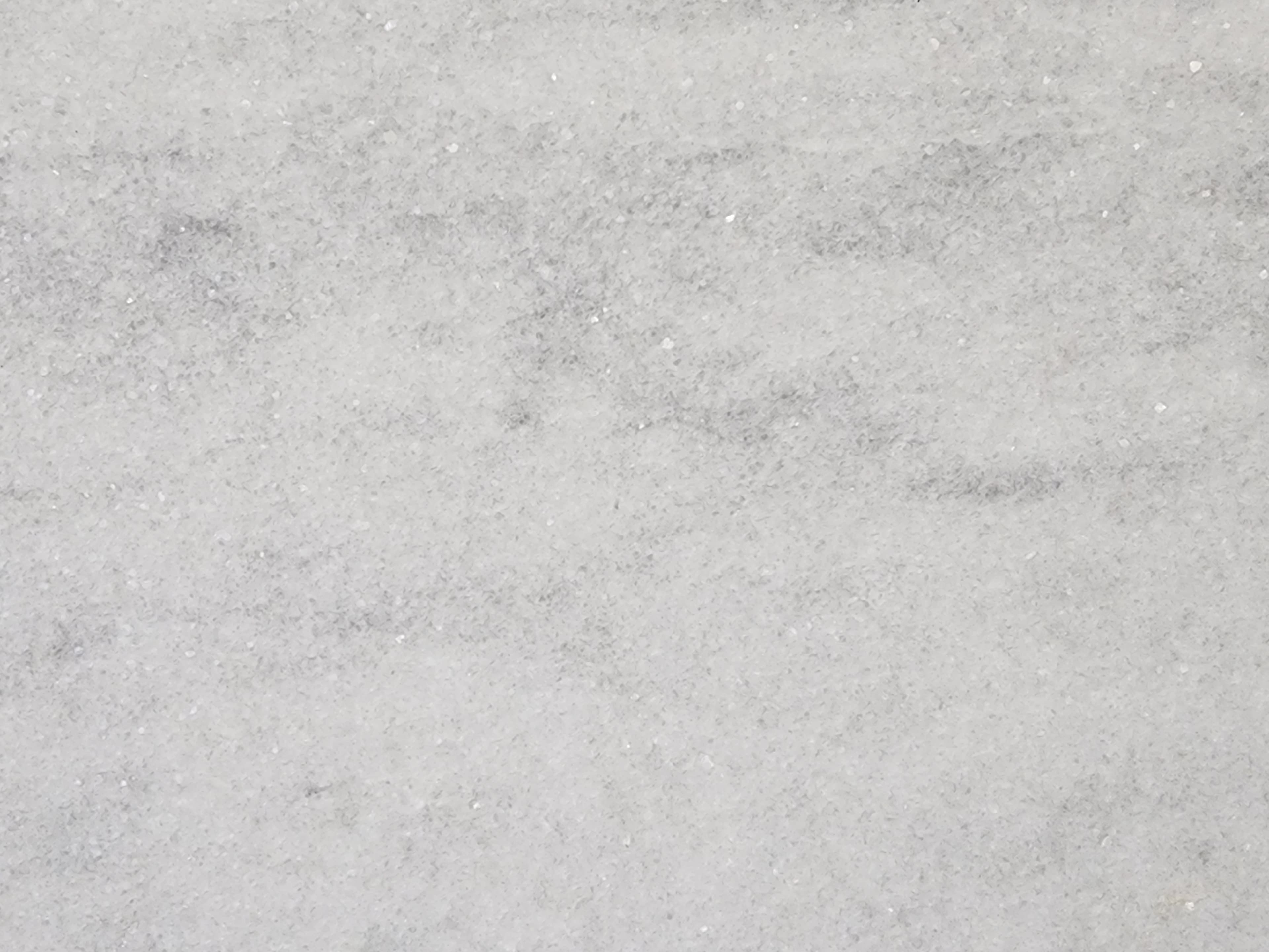 Bianco Tesoro Dual Finish, a marble slab, at KLZ Stone Supply in Dallas