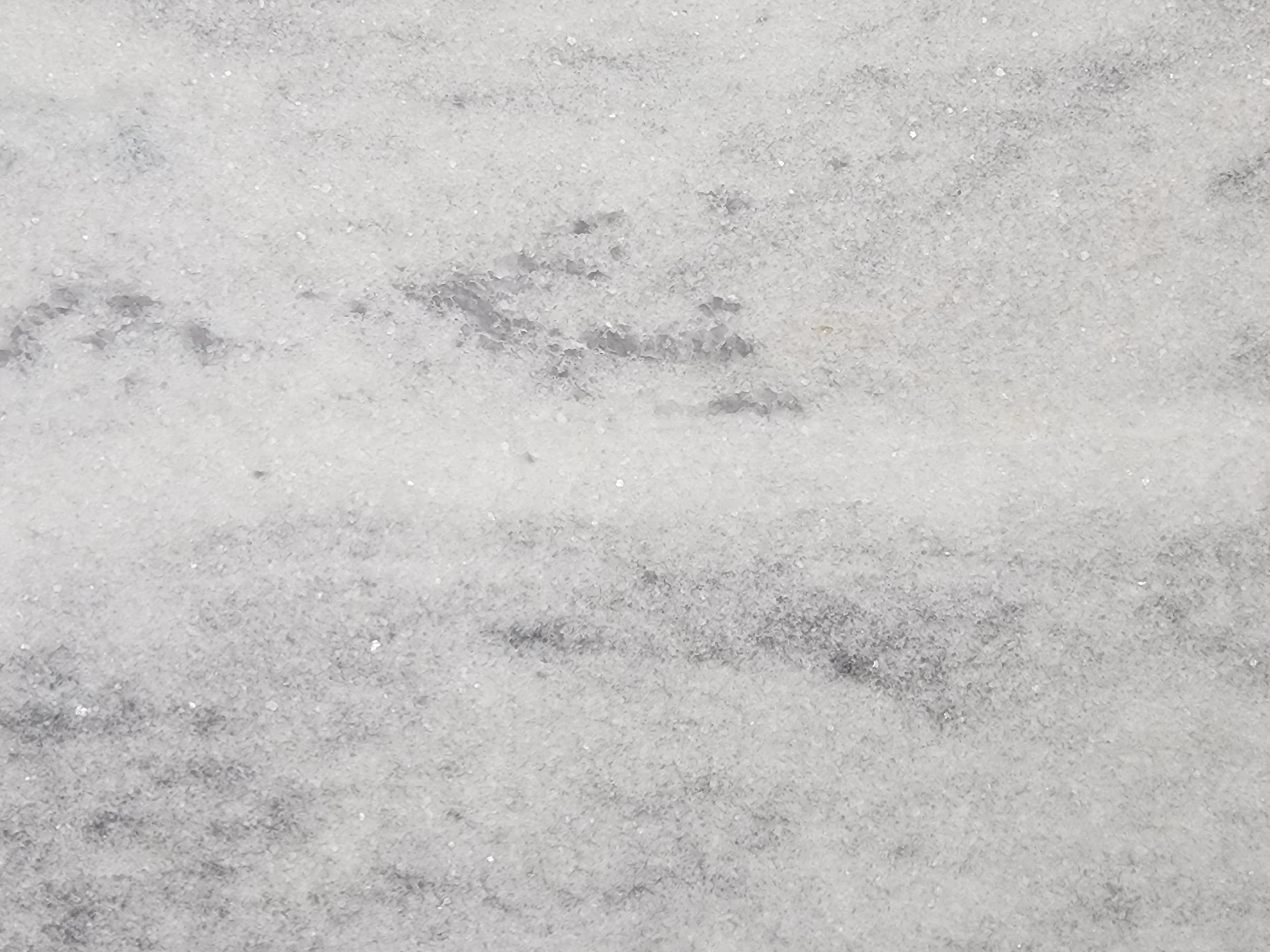Bianco Tesoro Leather, a marble slab, at KLZ Stone Supply in Dallas
