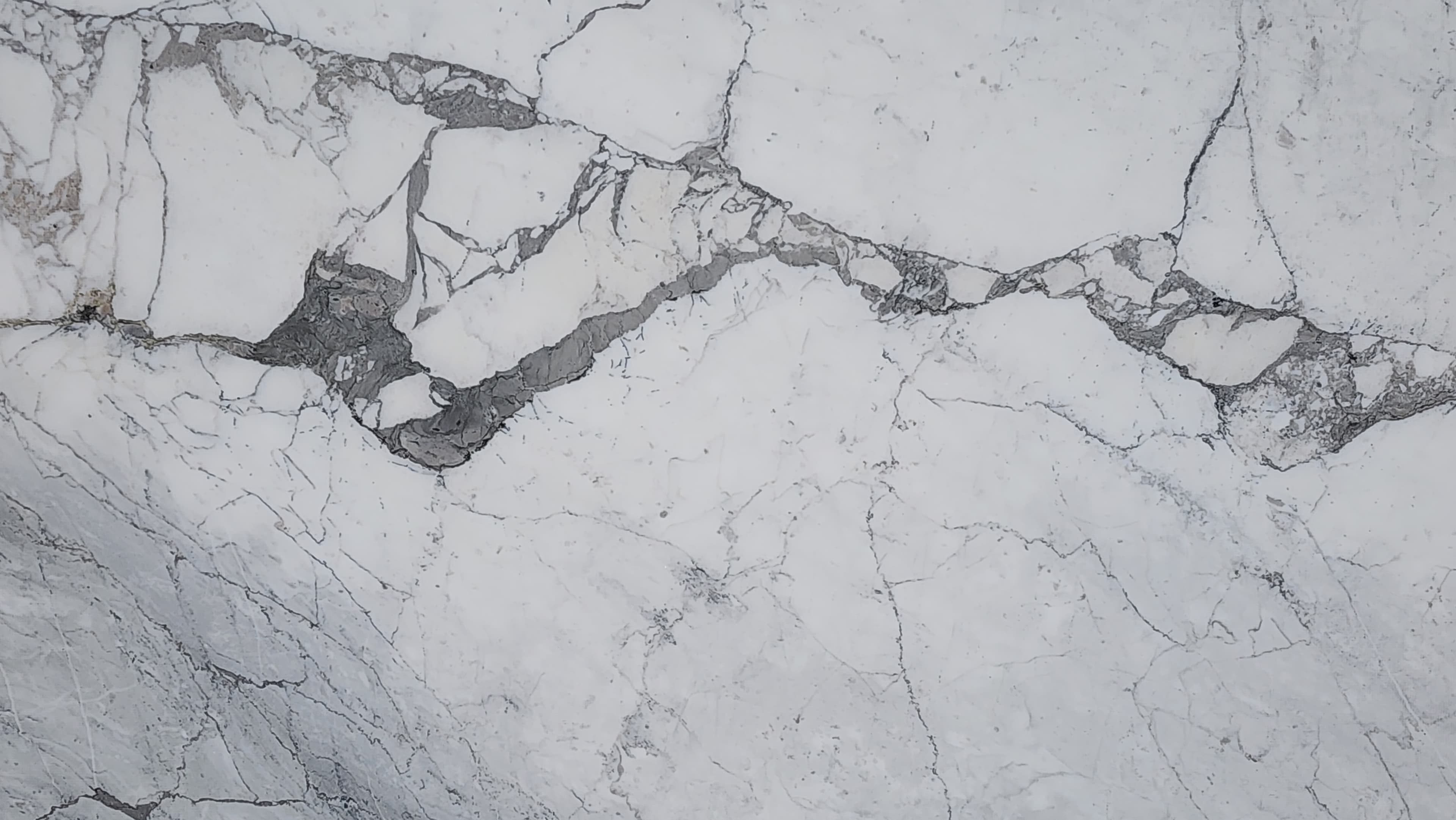 Calacatta Apuano Leather, a marble slab, at KLZ Stone Supply in Dallas
