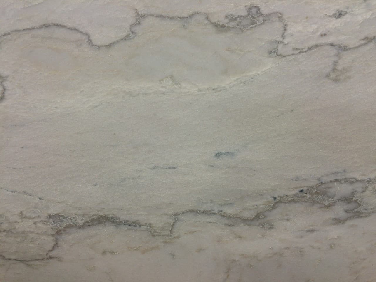 Calacatta Quartzite Leather, a quartzite slab, at KLZ Stone Supply in Dallas