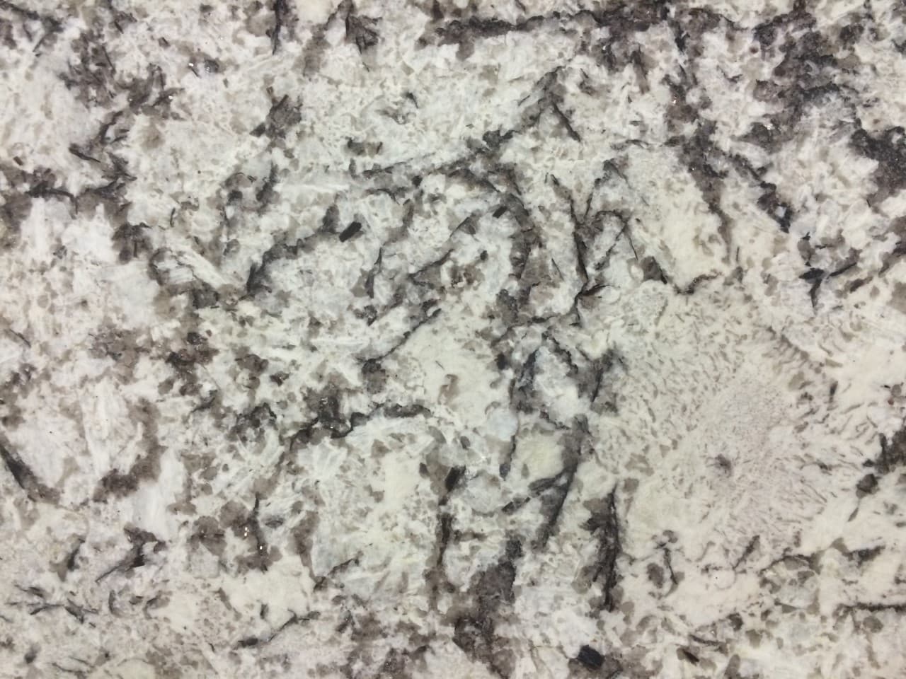 Delicatus Supreme Leather, a granite slab, at KLZ Stone Supply in Dallas